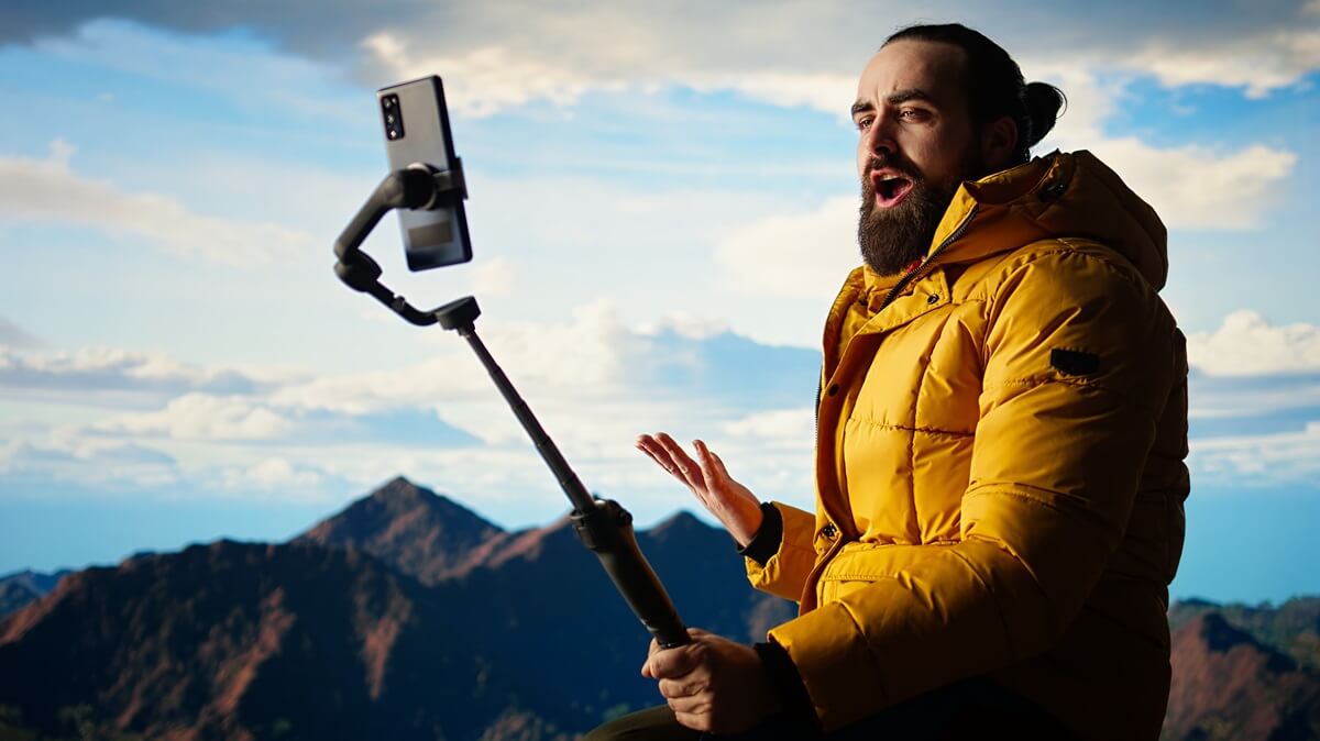 traveler-filming-his-hiking-experience-wilderness-documenting-his-adventure